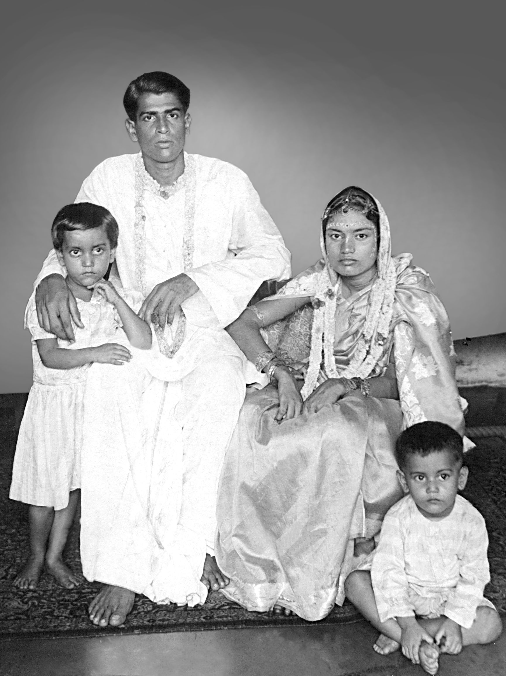 Hare Krishna Konar and Biva Konar with two children in an early family photograph
